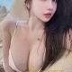 Attractive Chinese woman in a white top.