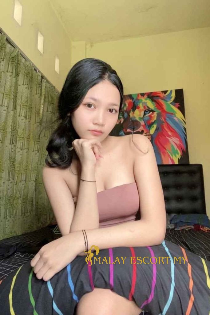 Attractive young woman in a pink top. Malay Escort My