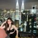 Attractive KL escort Hafizah enjoying Kuala Lumpur's skyline.