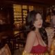 Attractive Malay escort girl, Nazirah, enjoying a cocktail at a bar.